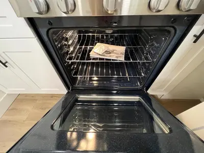 an oven with a book sitting inside of it at remodeled 2b 1b house Rosemead c in Rosemead