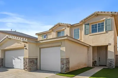 a large house with two garages at Desert Family Oasis 4BR Near Trails Attractions in Palmdale