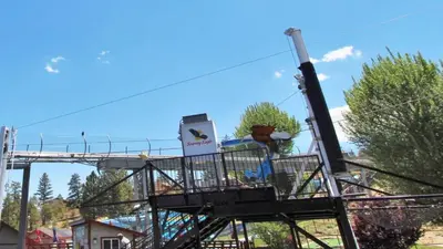 a ride at a playground with a sign on it at Walk to Village & Alpine Slide - Almost a View in Big Bear Lake
