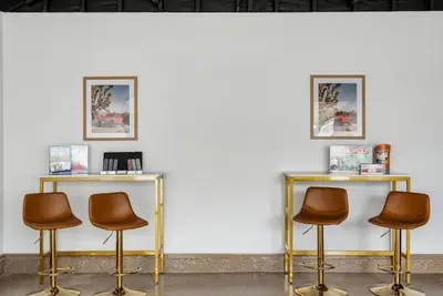 a group of three chairs in front of a wall at Cascade Cove - Heated Pool Spa - Billiards and Lounge in Long Beach