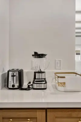 a kitchen counter with a blender on a counter top at Cascade Cove - Heated Pool Spa - Billiards and Lounge in Long Beach