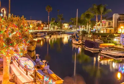 a marina at night with a christmas tree and boats at Trendy Getaway - Hot Tub - Putt Putt - Games in Long Beach