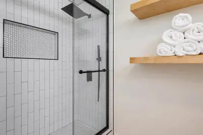 a shower with a glass door in a bathroom at 2-Story Sanctuary - Spacious Hot Tub - Billiards in Los Angeles