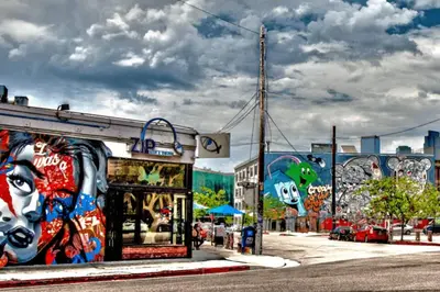 a building with graffiti on the side of a street at ArtsDistrictDtLA-2022 BUILT WithVIEWS WD - GARAGE in Los Angeles