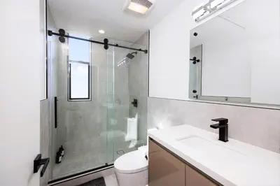 a bathroom with a shower and a sink and a toilet at Trendy Chic in Los Angeles