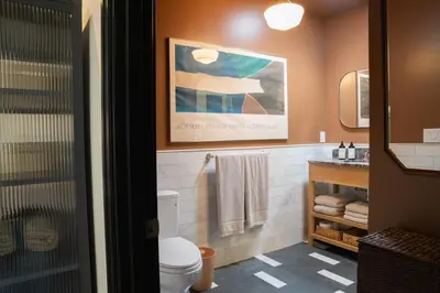 a bathroom with a toilet and a sink at Spanish-style garden Bungalow in Burbank