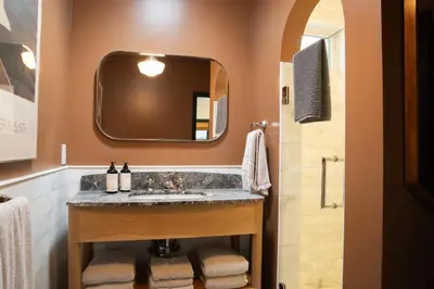 a bathroom with a sink and a mirror at Spanish-style garden Bungalow in Burbank