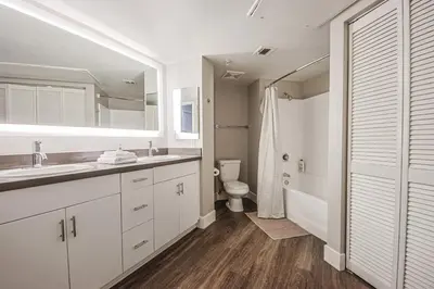 a white bathroom with a sink and a toilet at 3BR Apartment Near Santa Monica Pier in Los Angeles
