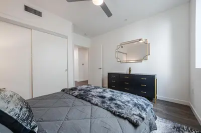a bedroom with a bed and a dresser and a mirror at 3BR Apartment Near Santa Monica Pier in Los Angeles