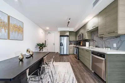 an open kitchen with a large island in the middle at 3BR Apartment Near Santa Monica Pier in Los Angeles