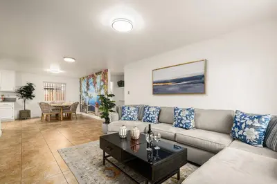 a living room with a couch and a table at Casa Lanzit - 35 Percent Off March 2026! in Los Angeles