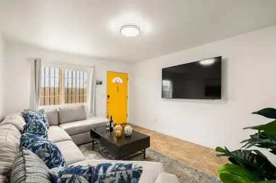 a living room with a couch and a tv at Casa Lanzit - 35 Percent Off March 2026! in Los Angeles