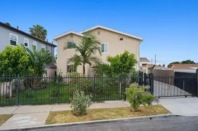 a black fence in front of a house at Casa Lanzit - 35 Percent Off March 2026! in Los Angeles