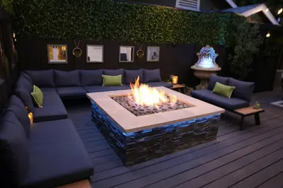 a living room with a couch and a fire pit at Historic Heart of Hollywood *Newly Renovated * in Los Angeles