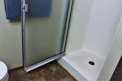 a shower with a glass door in a bathroom at Summit Ski Shack in Big Bear Lake