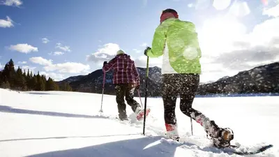 two people are cross country skiing in the snow at Summit Ski Shack in Big Bear Lake