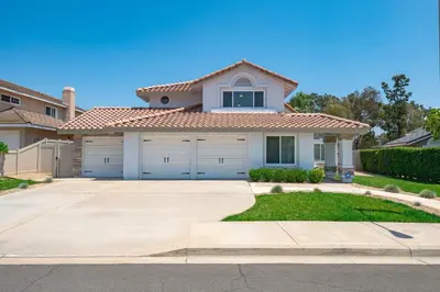 a house with two garage doors at Luxe Spacious Home Near Parks Fully Equipped in Riverside