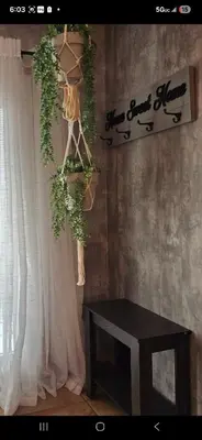 a room with a table and a white curtain at Zen Den Studio in Apple Valley