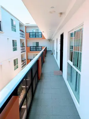 an empty hallway of a building with a corridor at Western Lemon Grove in Los Angeles