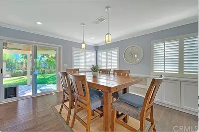 a dining room with a wooden table and chairs at Mountain View • Pool House in Chino Hills