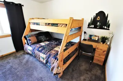 a bedroom with a bunk bed and a desk at Take a Break in Big Bear Lake