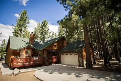 a log home with a garage and trees at Luxury w Spa Foosball Near Summit - DeCarlo House in Big Bear Lake