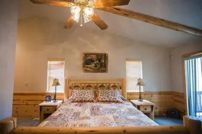 a bedroom with a large bed with two night stands at Luxury w Spa Foosball Near Summit - DeCarlo House in Big Bear Lake