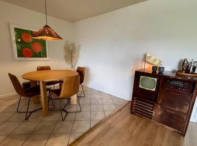 a dining room with a table and a small tv at Santa Monica 2BR Condo Views and Prime Location in Los Angeles