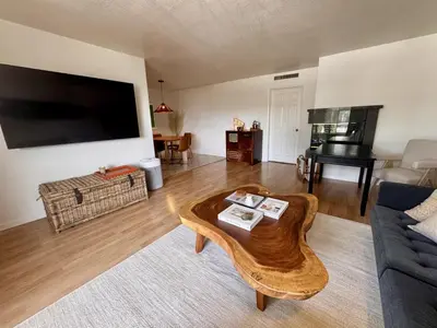 a living room with a coffee table and a flat screen tv at Santa Monica 2BR Condo Views and Prime Location in Los Angeles