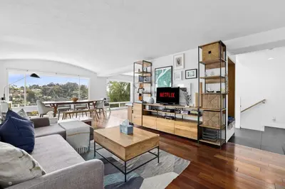a living room with a couch and a table at Spectacular Views and Tranquil Retreat in Los Feliz in Los Angeles