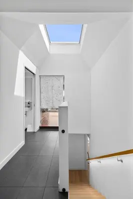 a room with white walls and a skylight at Spectacular Views and Tranquil Retreat in Los Feliz in Los Angeles
