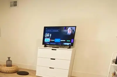a flat screen tv sitting on top of a white dresser at Private and Quiet Los Feliz Guest Suite with VIEWS in Los Angeles