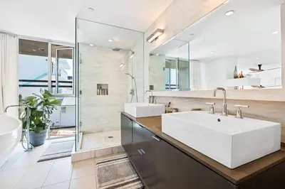 a bathroom with a white sink and a large mirror at The Blue Wave - 3 blocks from Manhattan Beach Pier in Manhattan Beach
