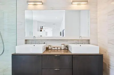 a bathroom with two sinks and a mirror at The Blue Wave - 3 blocks from Manhattan Beach Pier in Manhattan Beach