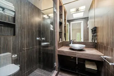 a bathroom with a sink and a mirror at Private Designer Home in West Hollywood in Los Angeles