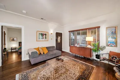 a living room with a couch and a table at Atwater Oasis with Pool and HotTub very Walkable Area in Glendale