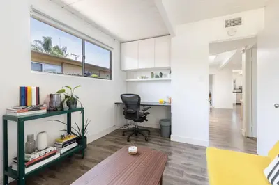 an office with a desk and a chair in a room at Eichler Mid-Century Perfect WFH, Relax and Entertain in Orange