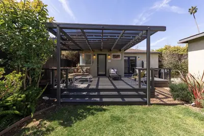 a deck with a pergola in a yard at Heart of Venice Designer Home Near Abbot Kinney in Los Angeles