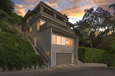 a house with a garage in front of it at Hollywood Dell Oasis, Canyon VIEWS, Fire Pit and BBQ in Los Angeles
