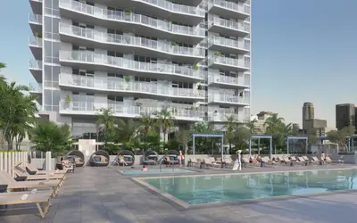 a hotel with a swimming pool and a building at Level Olympic in Los Angeles