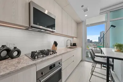 a kitchen with a stove and a counter top at Level Olympic in Los Angeles