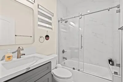 a bathroom with a shower and a toilet and a sink at Modern Getaway Near Pasadena & DTLA in Rosemead