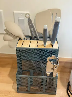 a tool box filled with utensils sitting on a floor at Charming Casita near USC, SOFI, and Culver City in Los Angeles