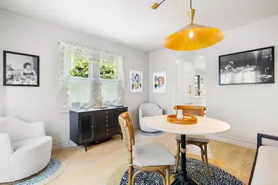 a living room with a table and a desk at Spanish Bungalow in Trendy Los Feliz For Families in Los Angeles