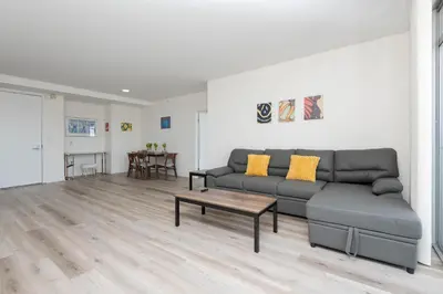 a living room with a couch and a table at Skyline Suites in North Hollywood