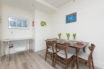 a dining room with a table and chairs at Skyline Suites in North Hollywood