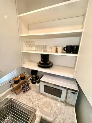 a kitchen with a microwave on a counter at Cozy home in Franklin Village, Central location! in Los Angeles