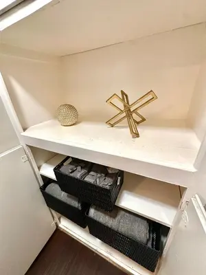 a shelf in a closet with a cross on it at Cozy home in Franklin Village, Central location! in Los Angeles