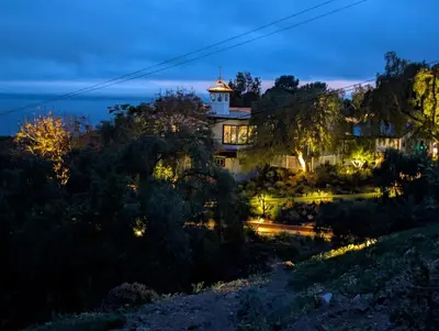 a house with a tower on top of a hill at night at LA Coastal Oasis in Rancho Palos Verdes