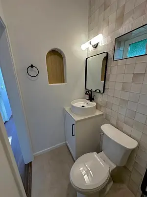 a bathroom with a white toilet and a sink at LA Coastal Oasis in Rancho Palos Verdes